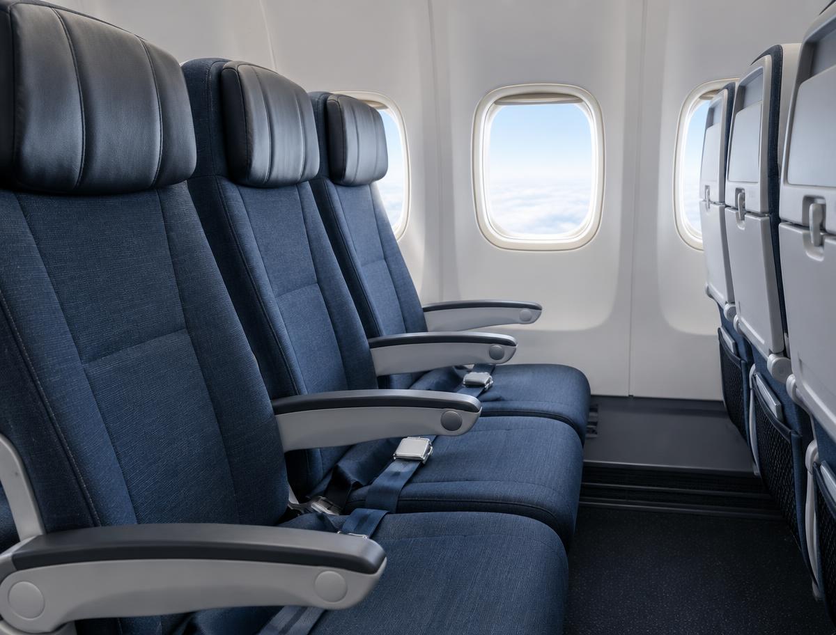 Illustrative image of an empty row of aircraft seats; not a specific airline